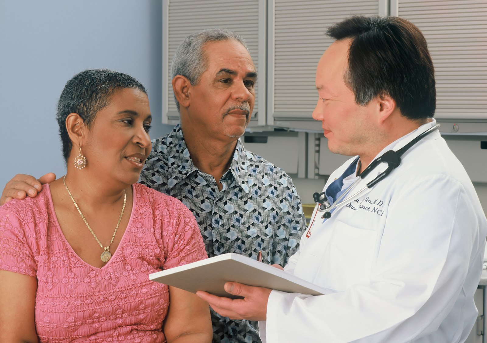 Clinician consulting with patients